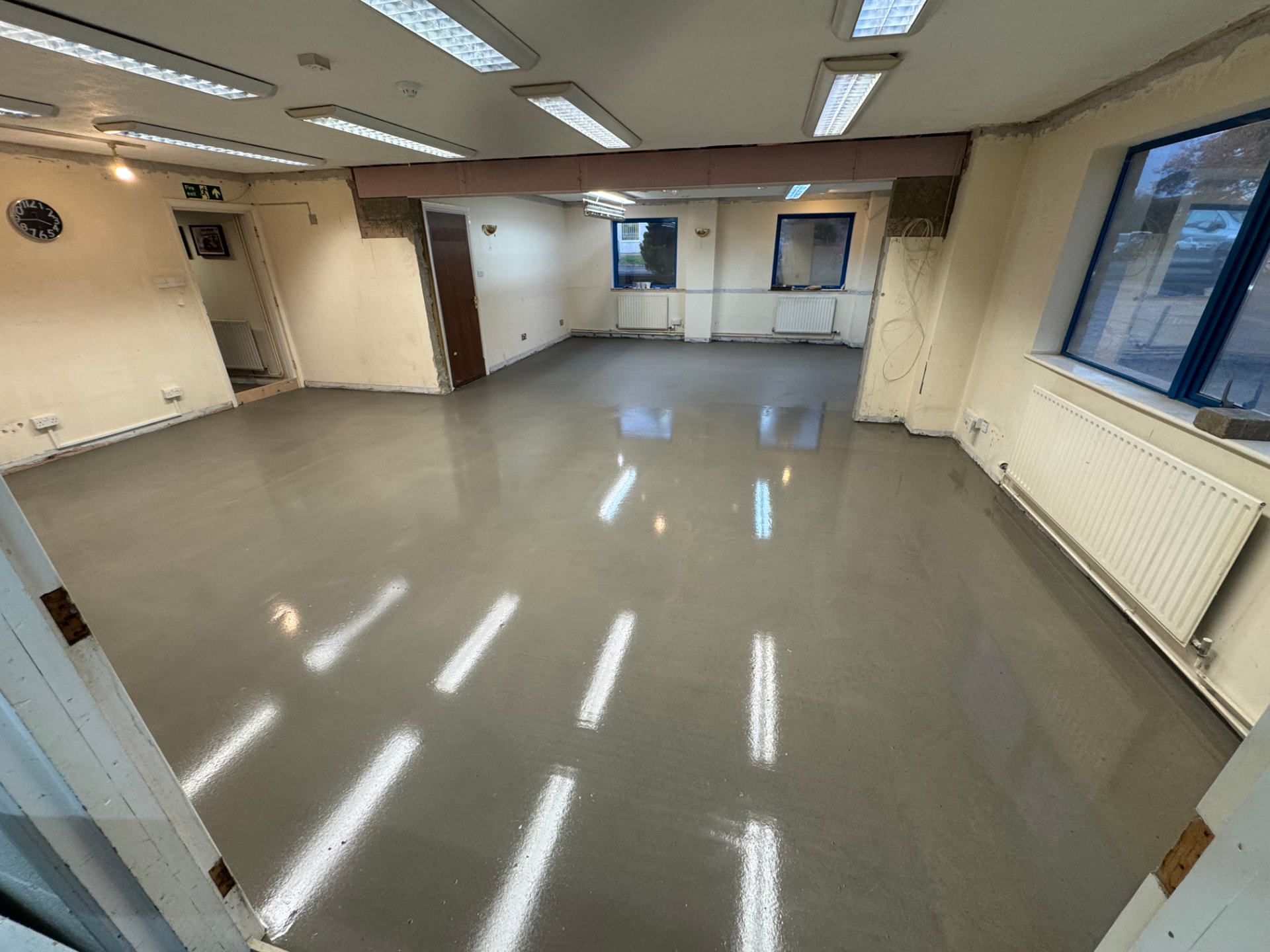 Large commercial space with a freshly levelled reflective floor